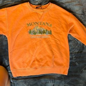 forever 21. size m. orange and green.